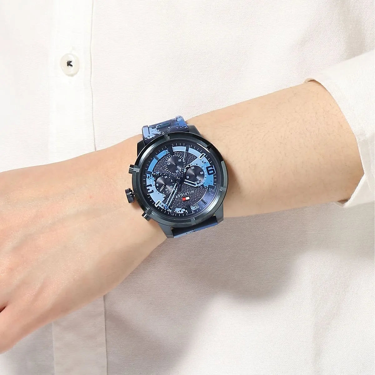 Tommy Hilfiger Wild Blue Chronograph watch worn on wrist with blue splatter dial