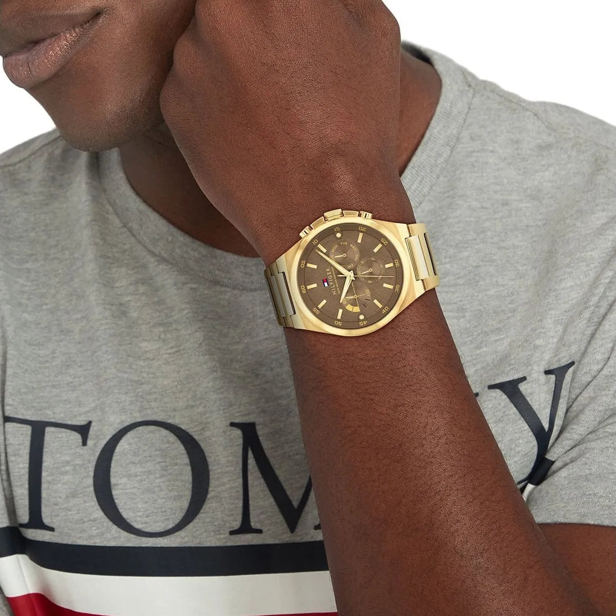 Tommy Hilfiger Dexter multifunction watch on wrist with brown dial and chronograph