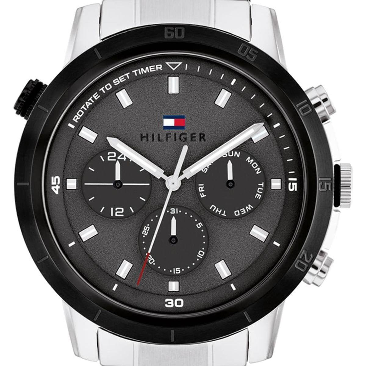 Close-up of black dial showing multifunction chronograph subdials and white hour markers