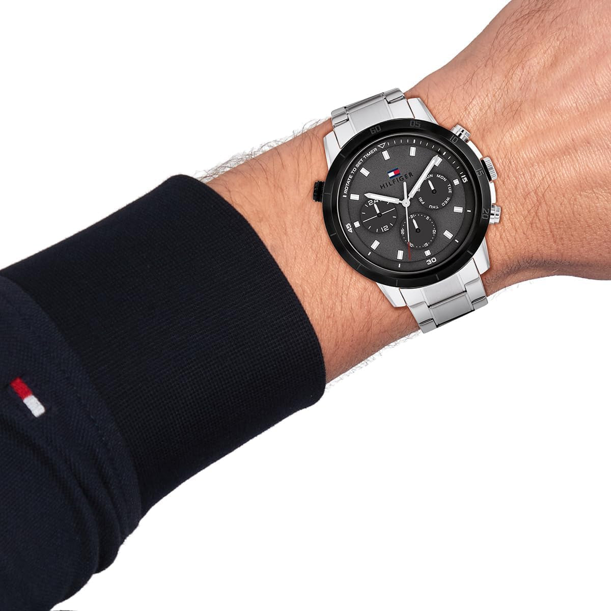 Tommy Hilfiger chronograph watch worn on wrist with stainless steel strap