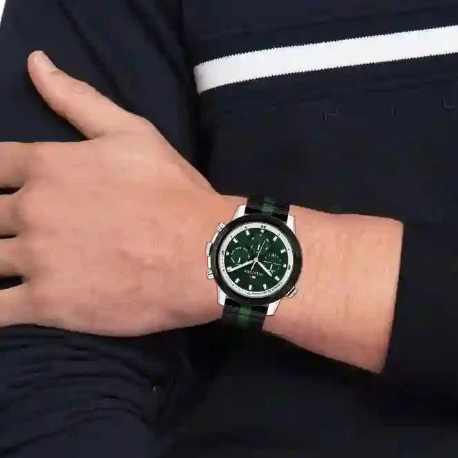 Tommy Hilfiger Troy men's watch worn on wrist showing green dial and striped strap