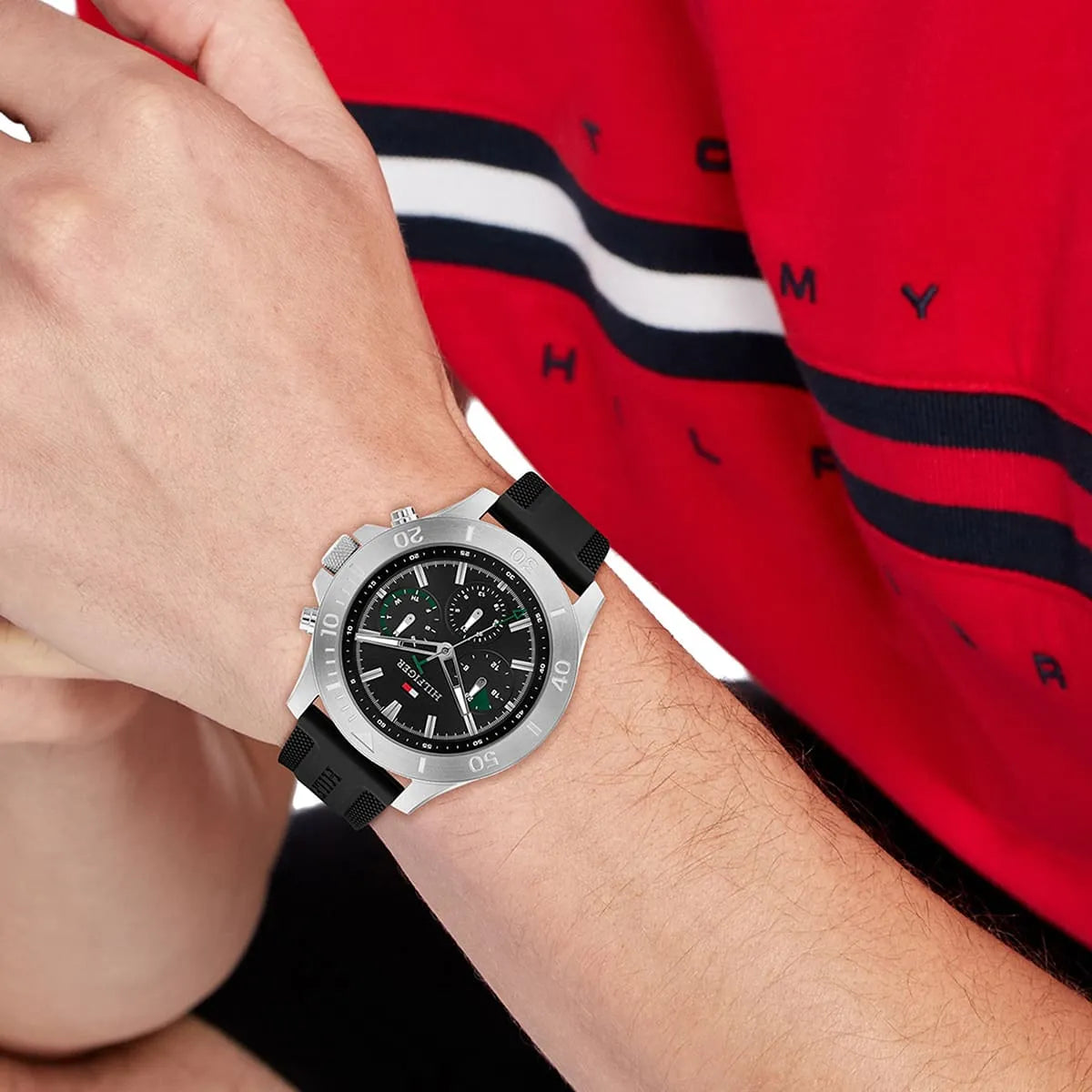 Tommy Hilfiger chronograph watch worn on wrist with black silicone strap