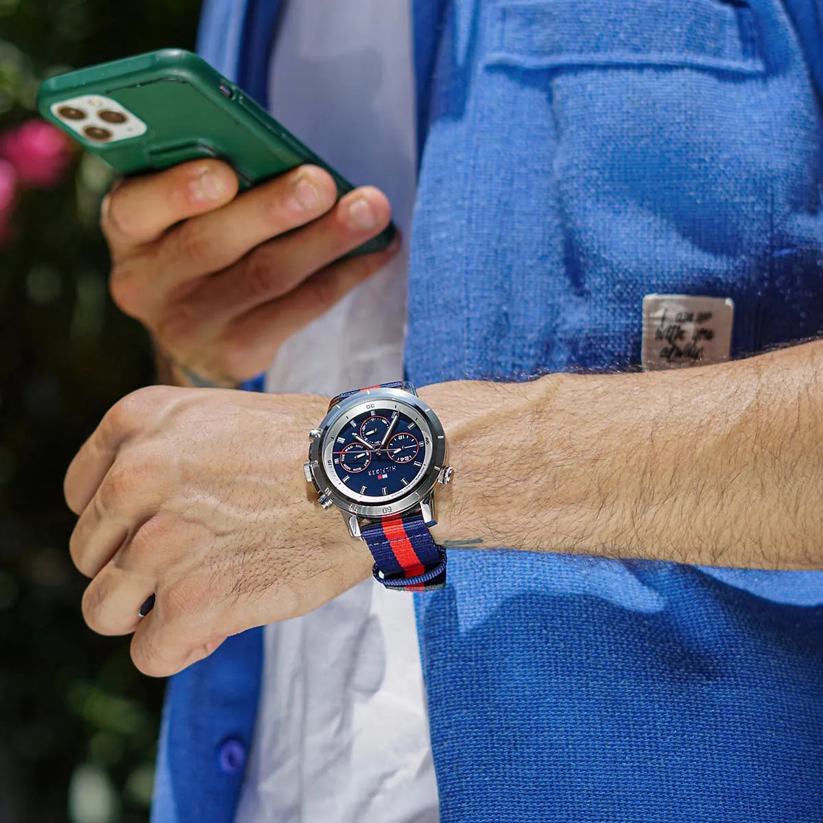 On-wrist view of Tommy Hilfiger chronograph watch with navy-red striped fabric strap