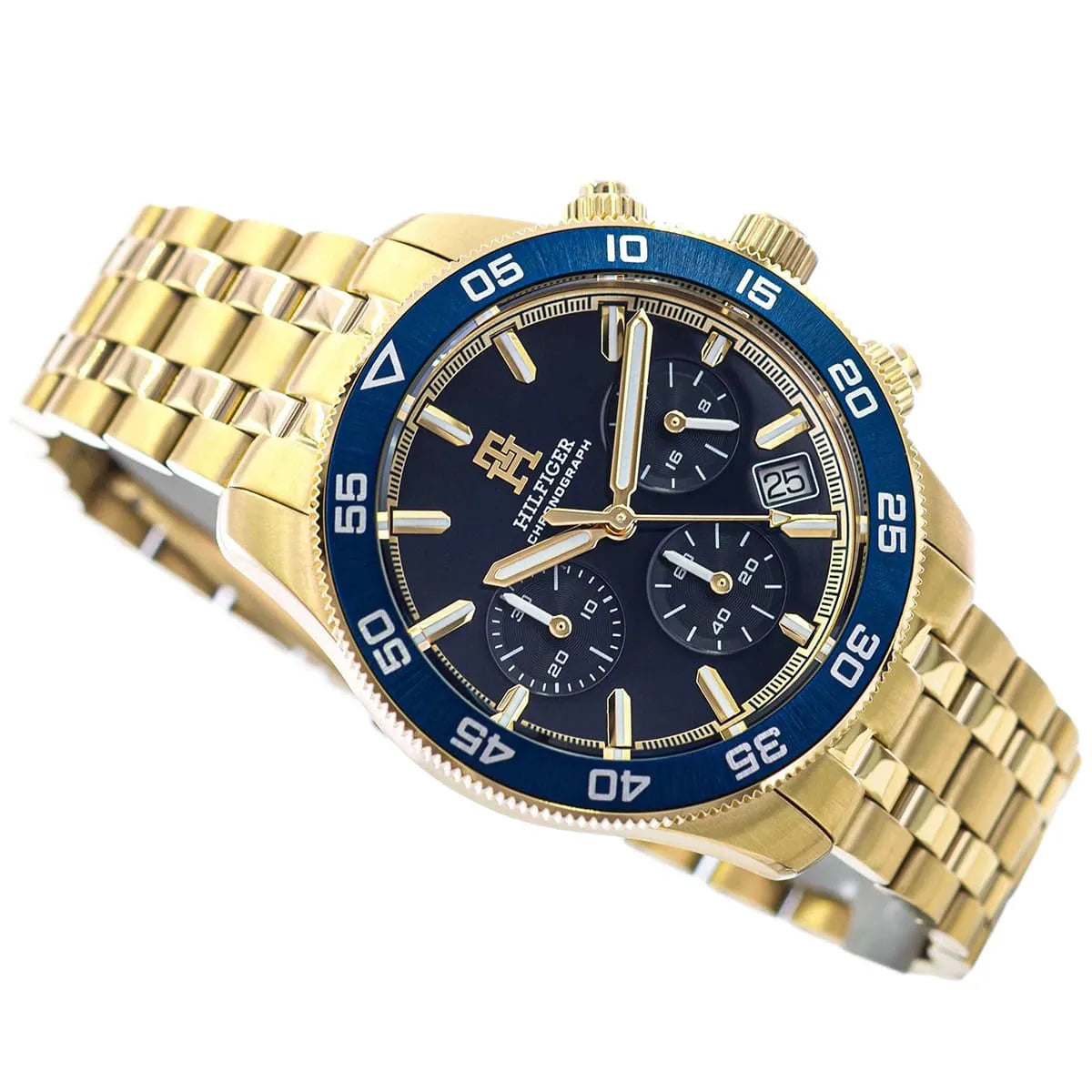 Tommy Hilfiger gold chronograph watch positioned at angle showing dial and bracelet detail