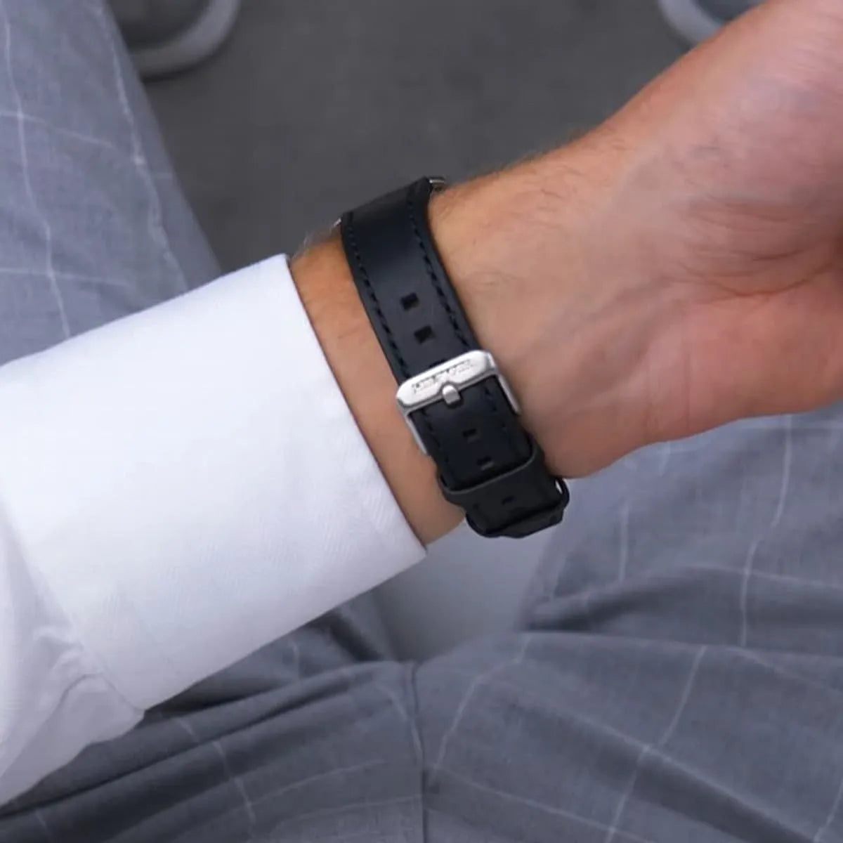 Tommy Hilfiger TH85 watch worn on wrist showing black leather strap detail
