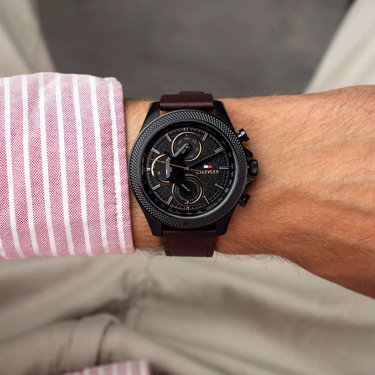 Tommy Hilfiger chronograph watch worn on wrist with brown leather strap