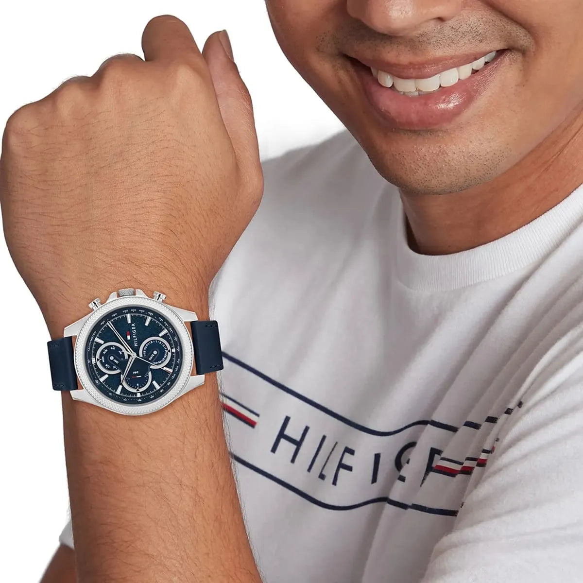 Tommy Hilfiger Clark chronograph watch on wrist with blue dial and silver case