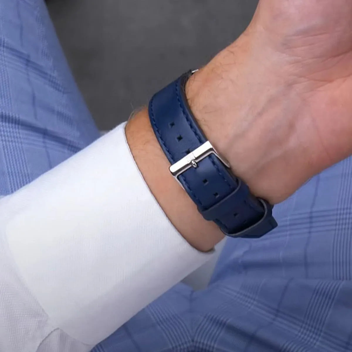 Close-up of Tommy Hilfiger Clark navy leather strap with metal buckle clasp