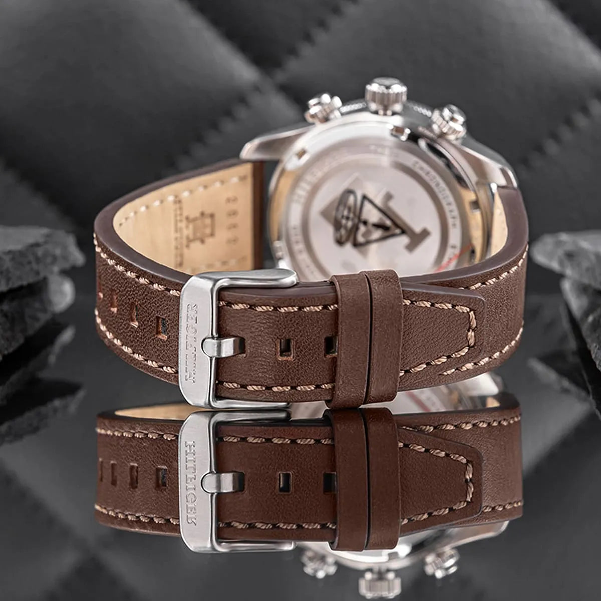 TH85 watch displayed with brown leather strap detail and case back visible