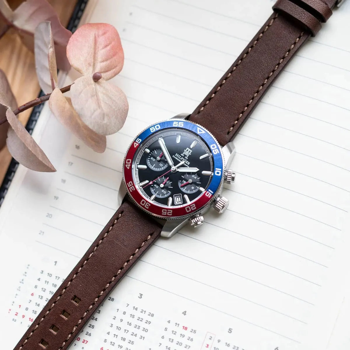 TH85 chronograph watch on wrist with calendar and chronograph dials visible