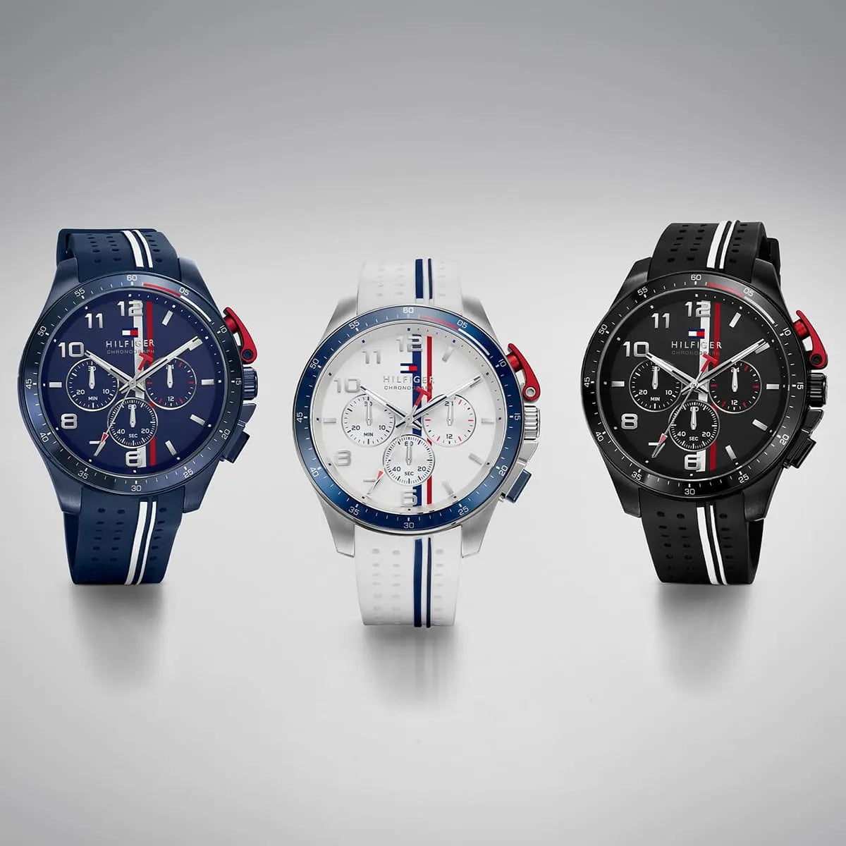 Tommy Hilfiger chronograph collection featuring blue, white, and black silicone strap variants