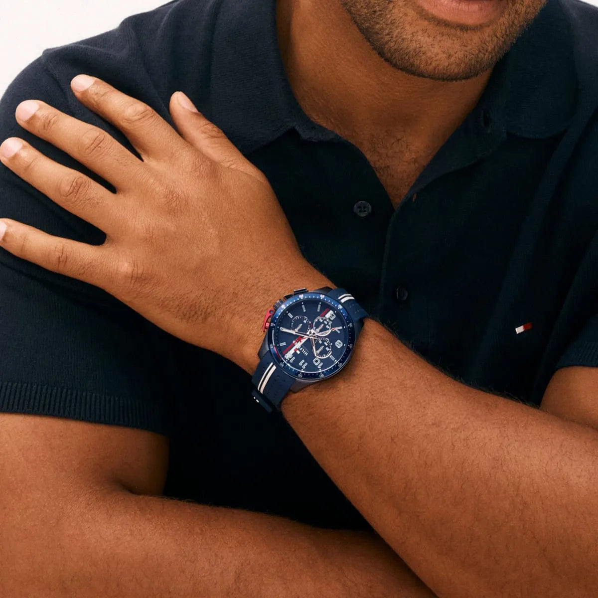 Tommy Hilfiger Bank watch worn on wrist showing blue dial and silicon strap