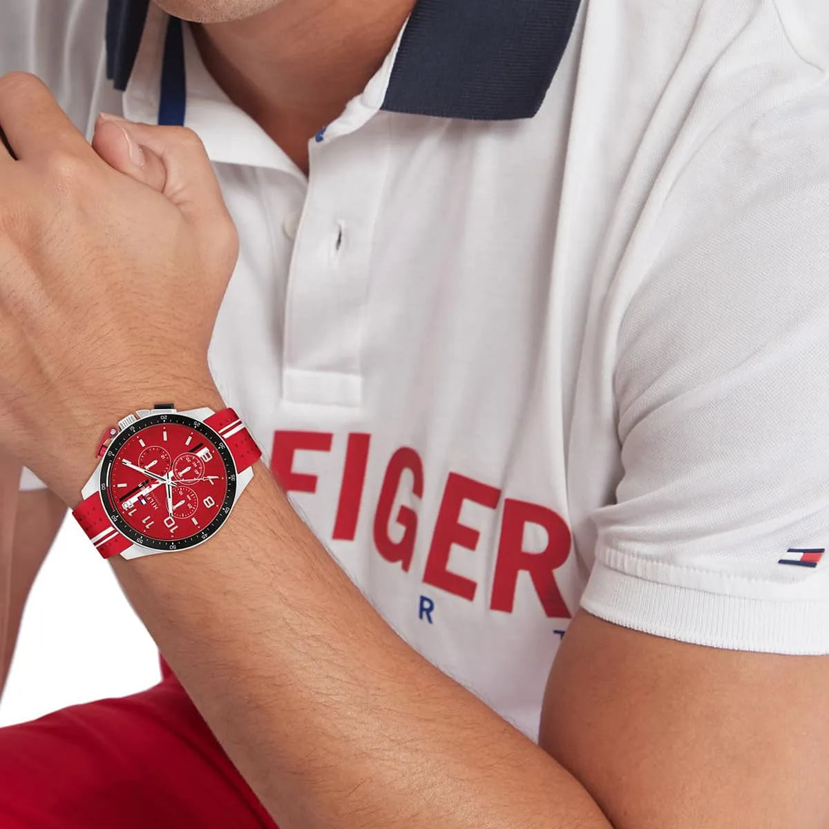 Tommy Hilfiger red chronograph watch worn on wrist with red silicone strap