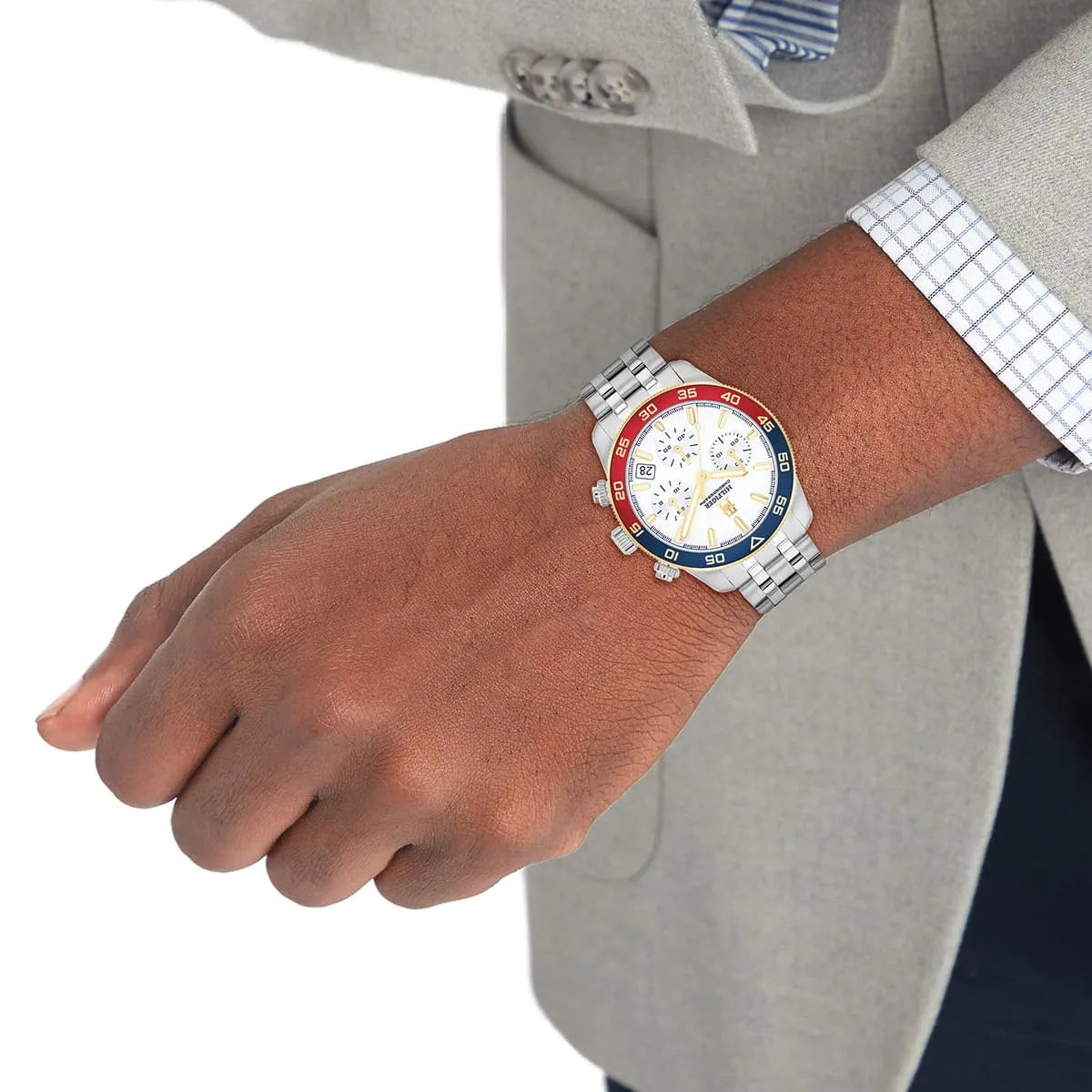 Tommy Hilfiger chronograph watch worn on wrist in formal attire