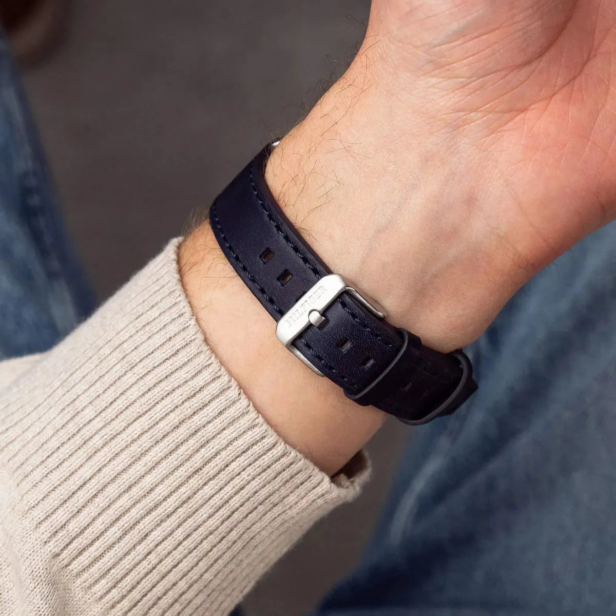 Tommy Hilfiger navy leather watch strap detail with stitching and buckle