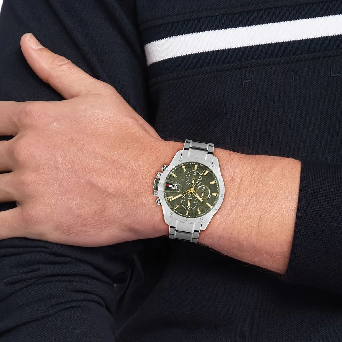 Tommy Hilfiger Jameson chronograph worn on wrist with green dial and silver metal strap