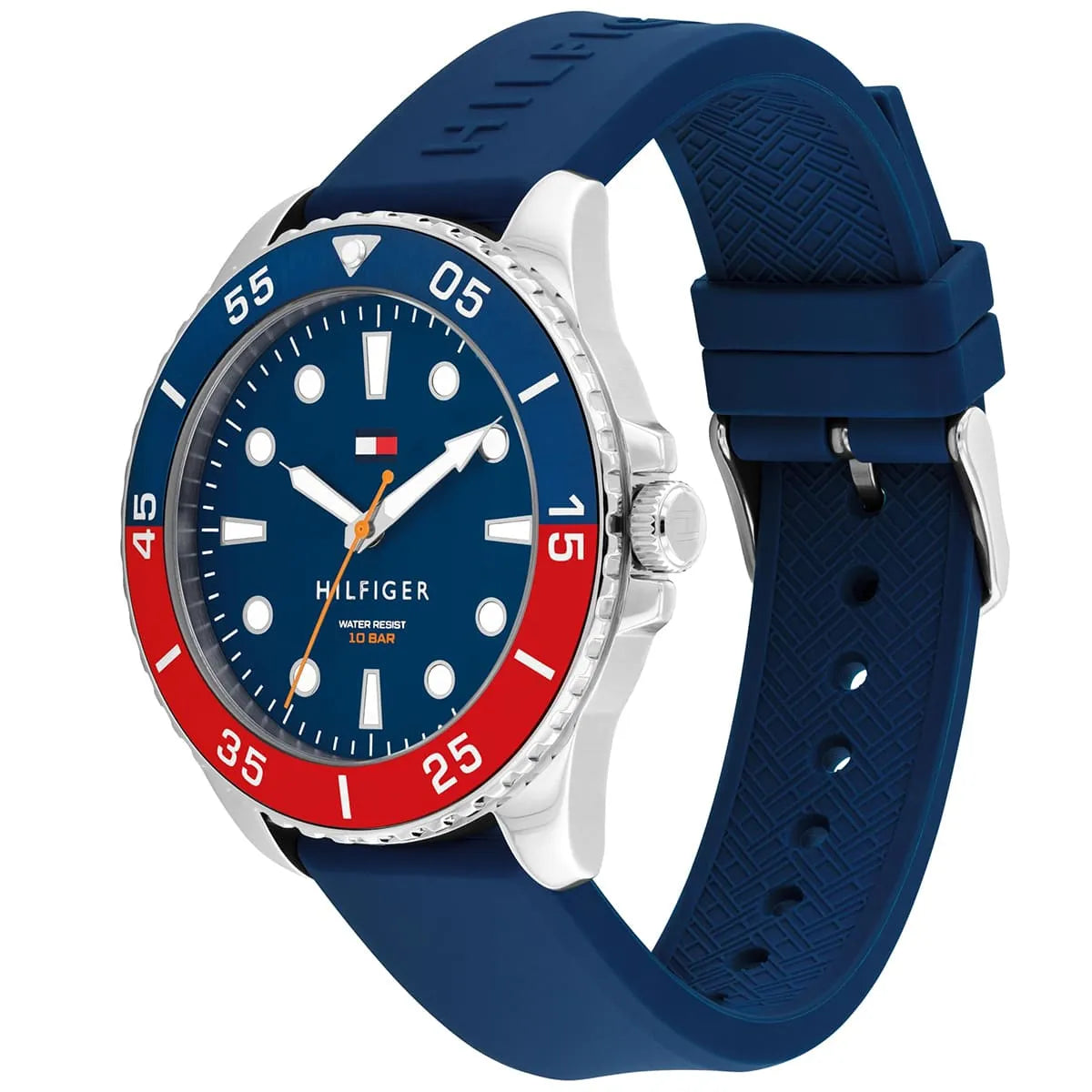 Tommy Hilfiger watch at angle showing silver case, blue dial, red bezel section, and navy silicone strap