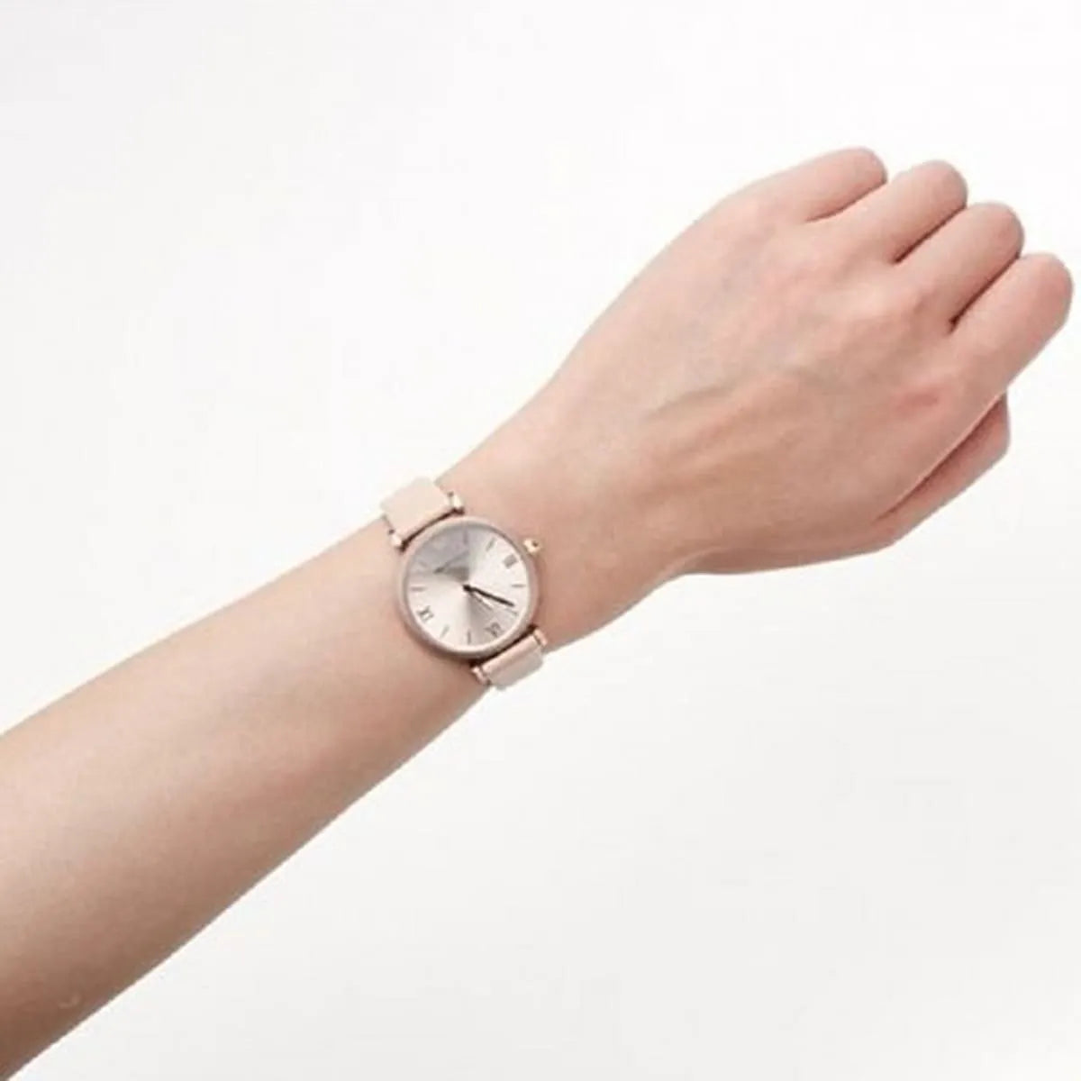 Emporio Armani Gianni T-Bar watch worn on wrist with rose gold dial and pink leather strap