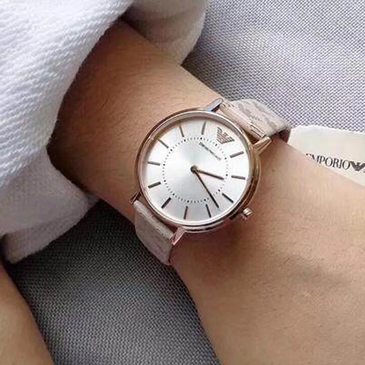 Emporio Armani AR11009 women's watch on wrist with beige leather strap