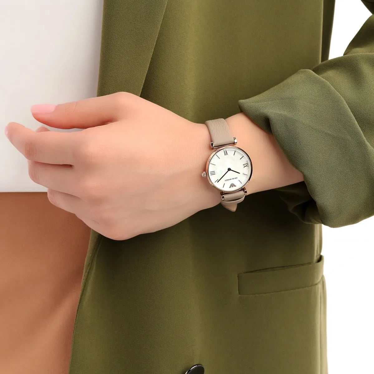 Emporio Armani AR11111 watch worn on wrist showing white dial and beige leather strap styling