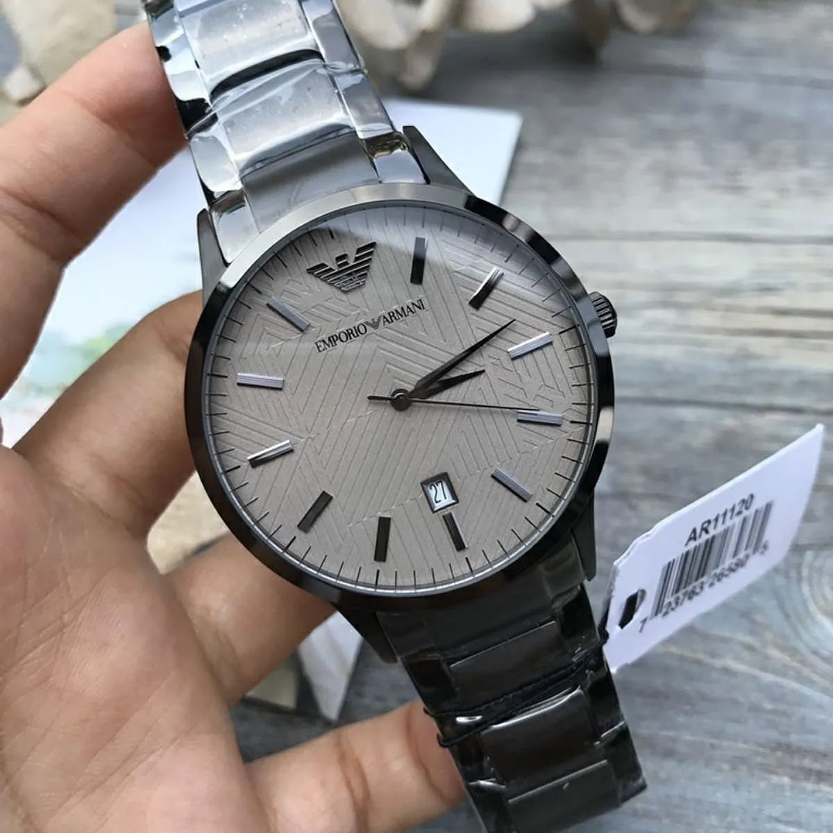 AR11120 Emporio Armani watch worn on wrist showing beige dial and stainless steel case