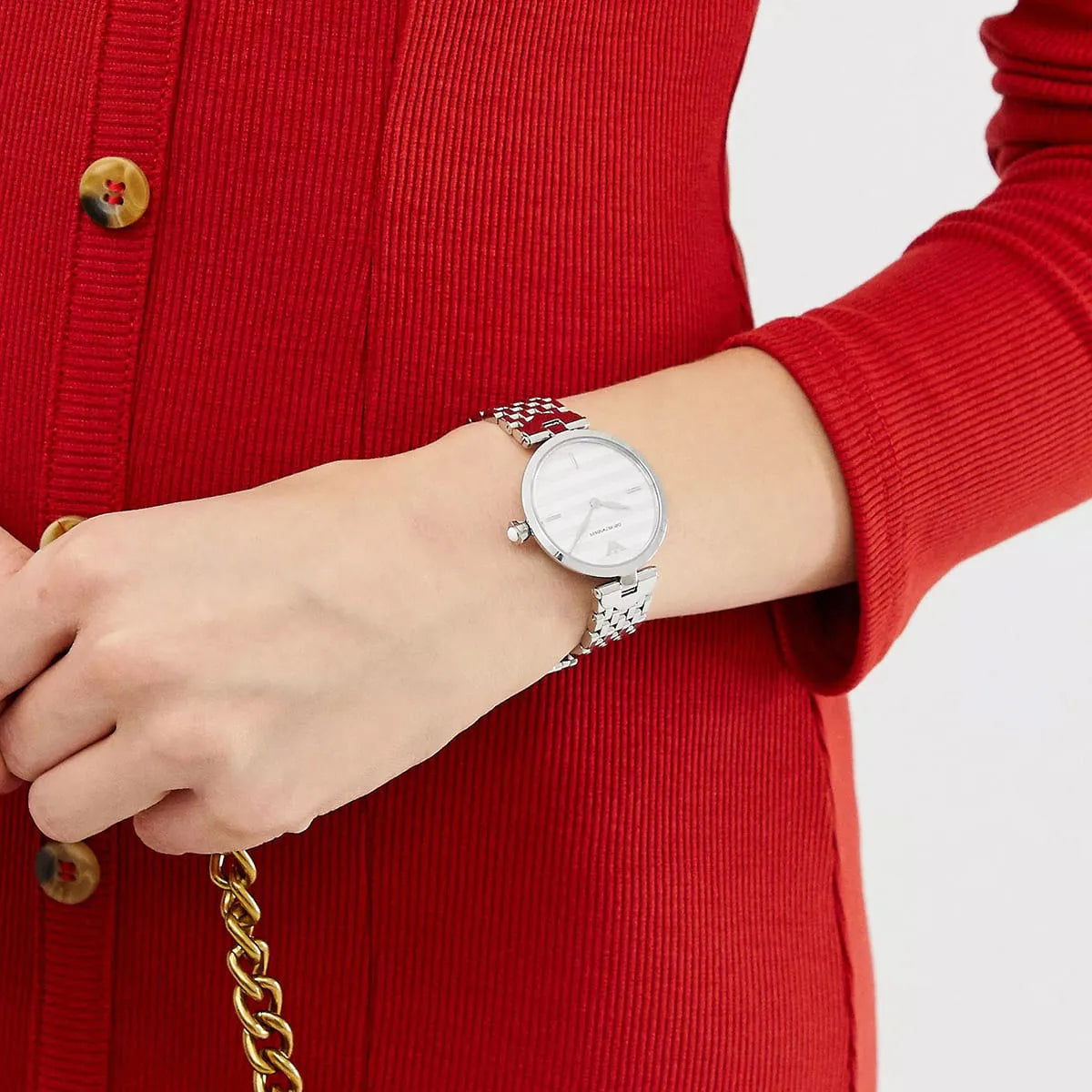 Emporio Armani Arianna women's watch on wrist showing white dial and silver metal strap