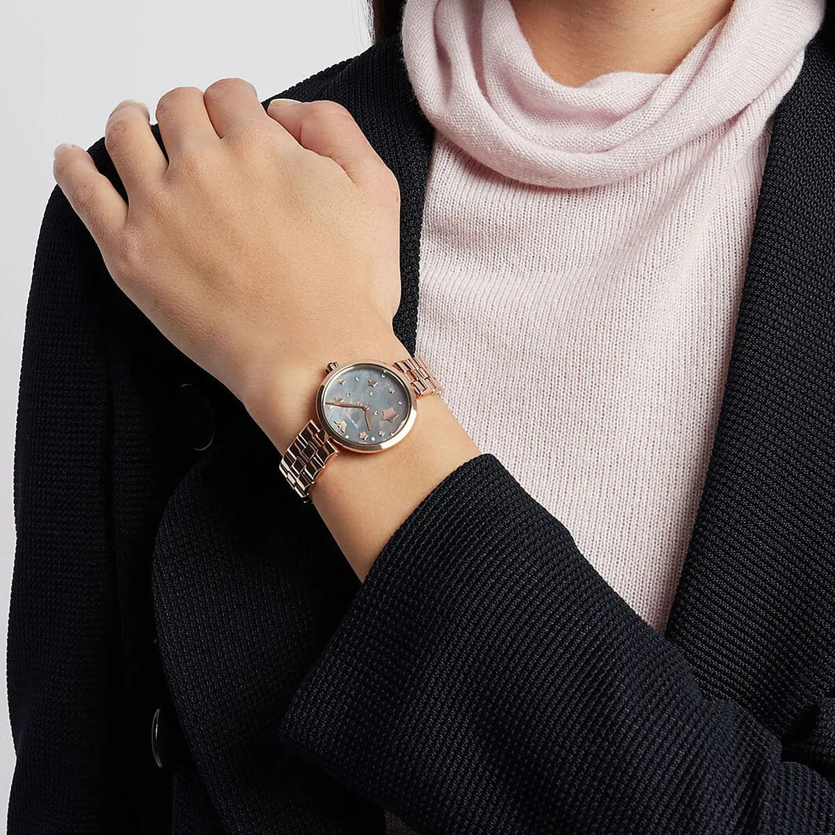 Emporio Armani Arianna women's watch worn on wrist showing black dial with rose gold case