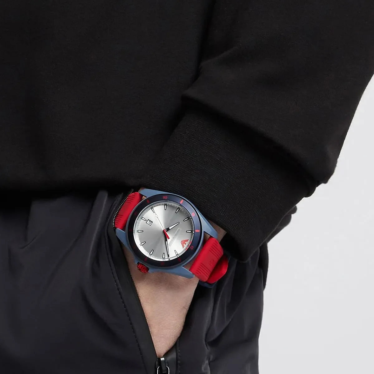 Emporio Armani AR11219 watch worn on wrist showing silver dial and red strap in use