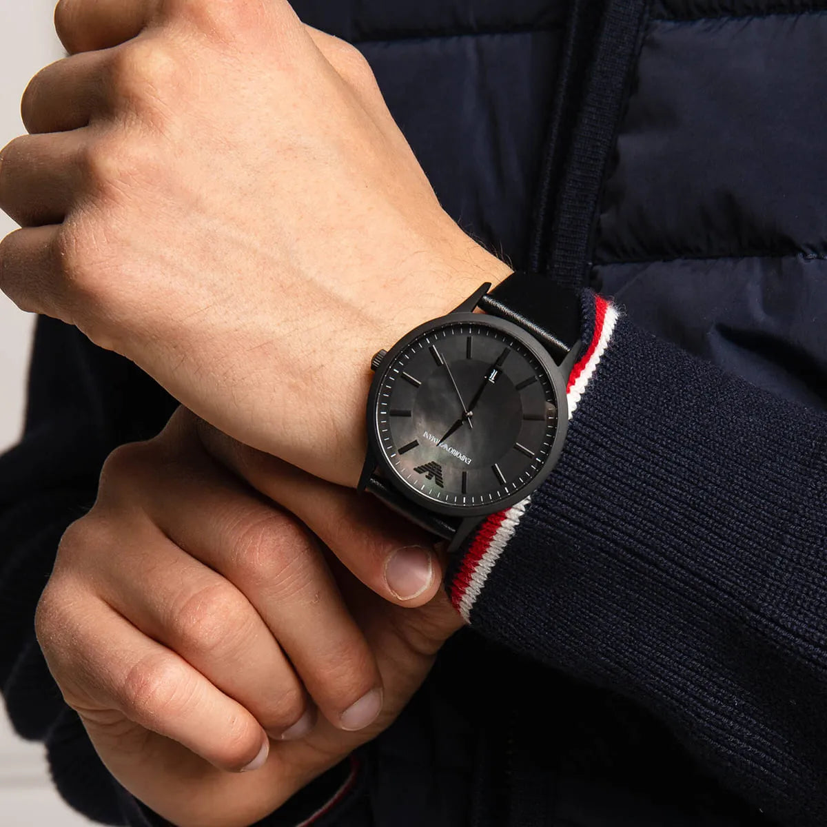Emporio Armani Renato watch worn on wrist with black leather strap