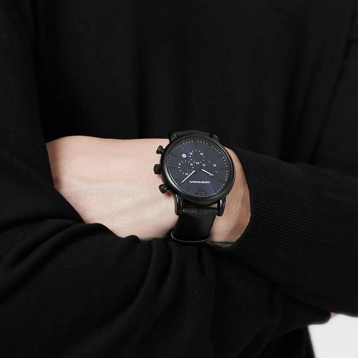 Emporio Armani AR11351 men's chronograph watch on wrist over black clothing