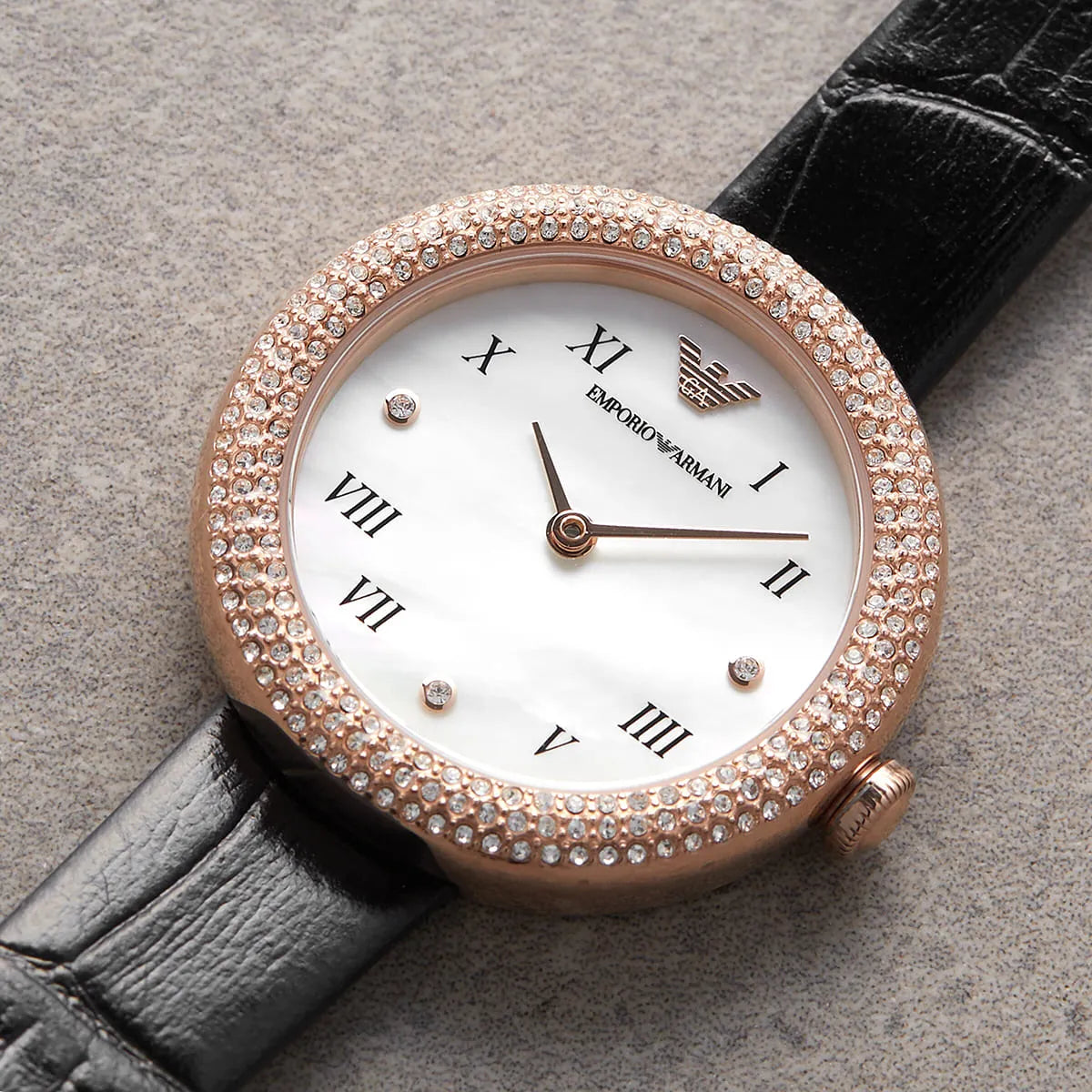 Emporio Armani AR11356 white mother-of-pearl dial detail with Roman numerals, rose gold hour markers, and rose gold hands
