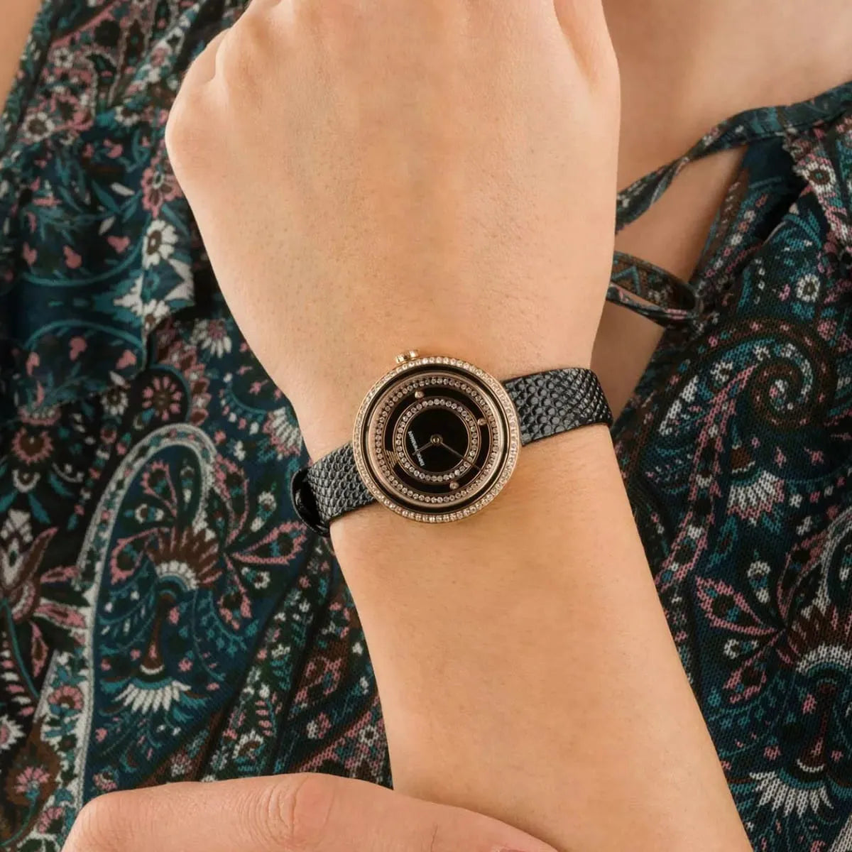 Woman wearing Emporio Armani Rosa watch with crystal-set rose gold case