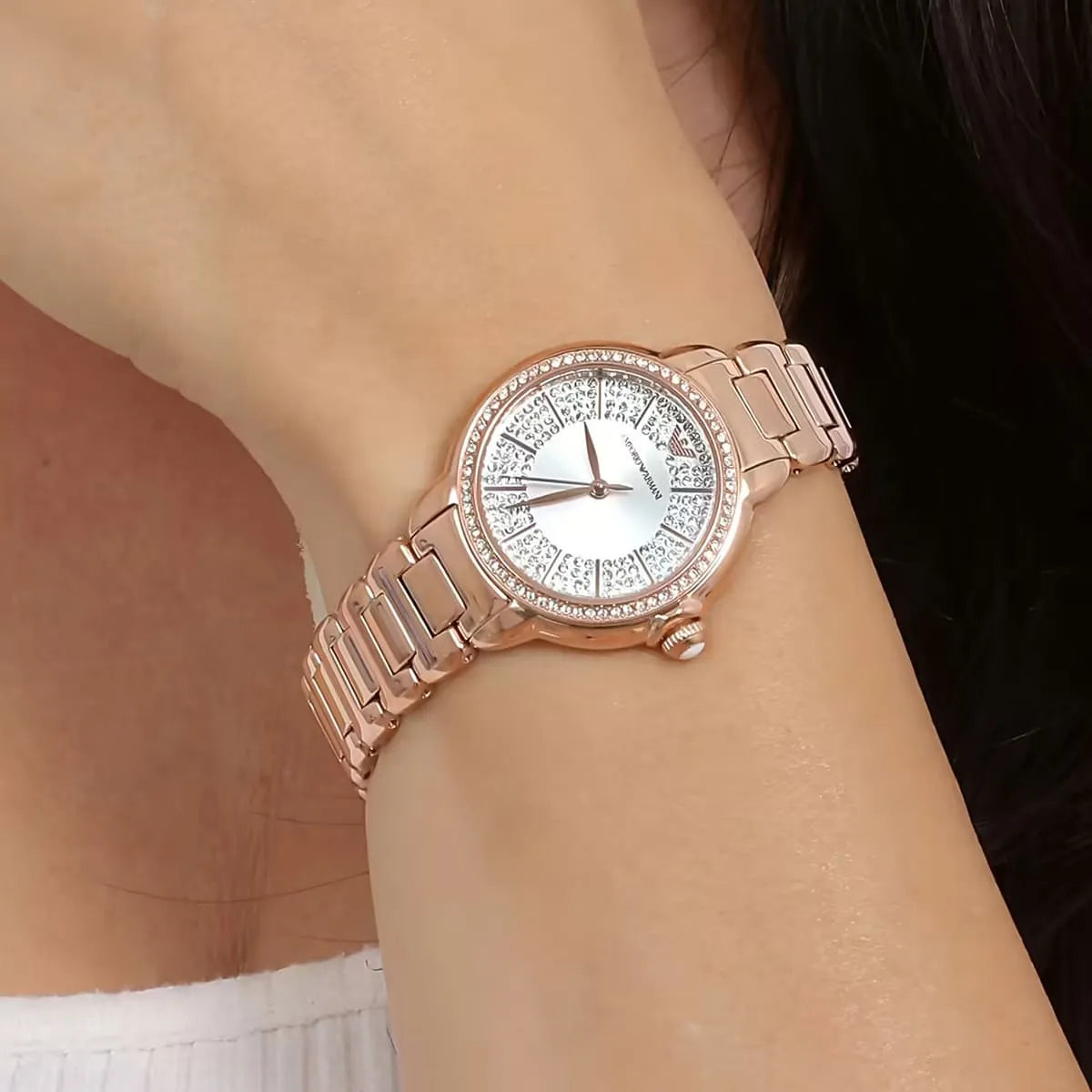 Emporio Armani Mia rose-gold women's watch worn on wrist with starry night dial
