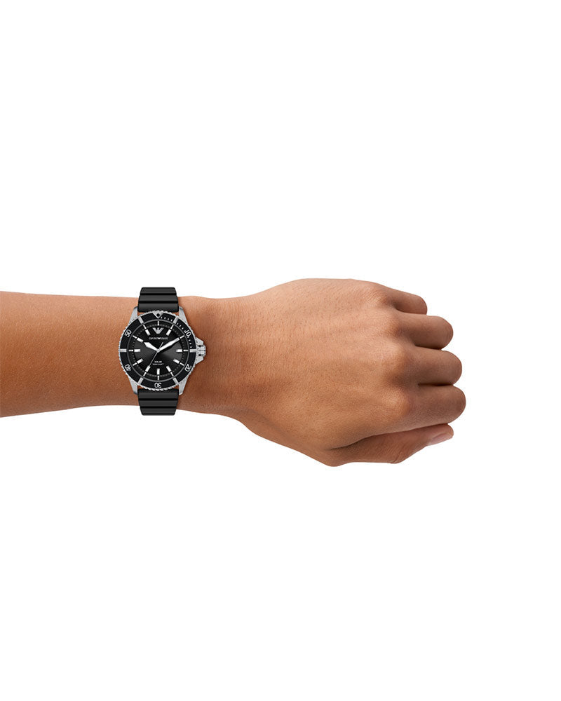 AR11788 solar watch worn on wrist, displaying black dial with white markers and rotating bezel