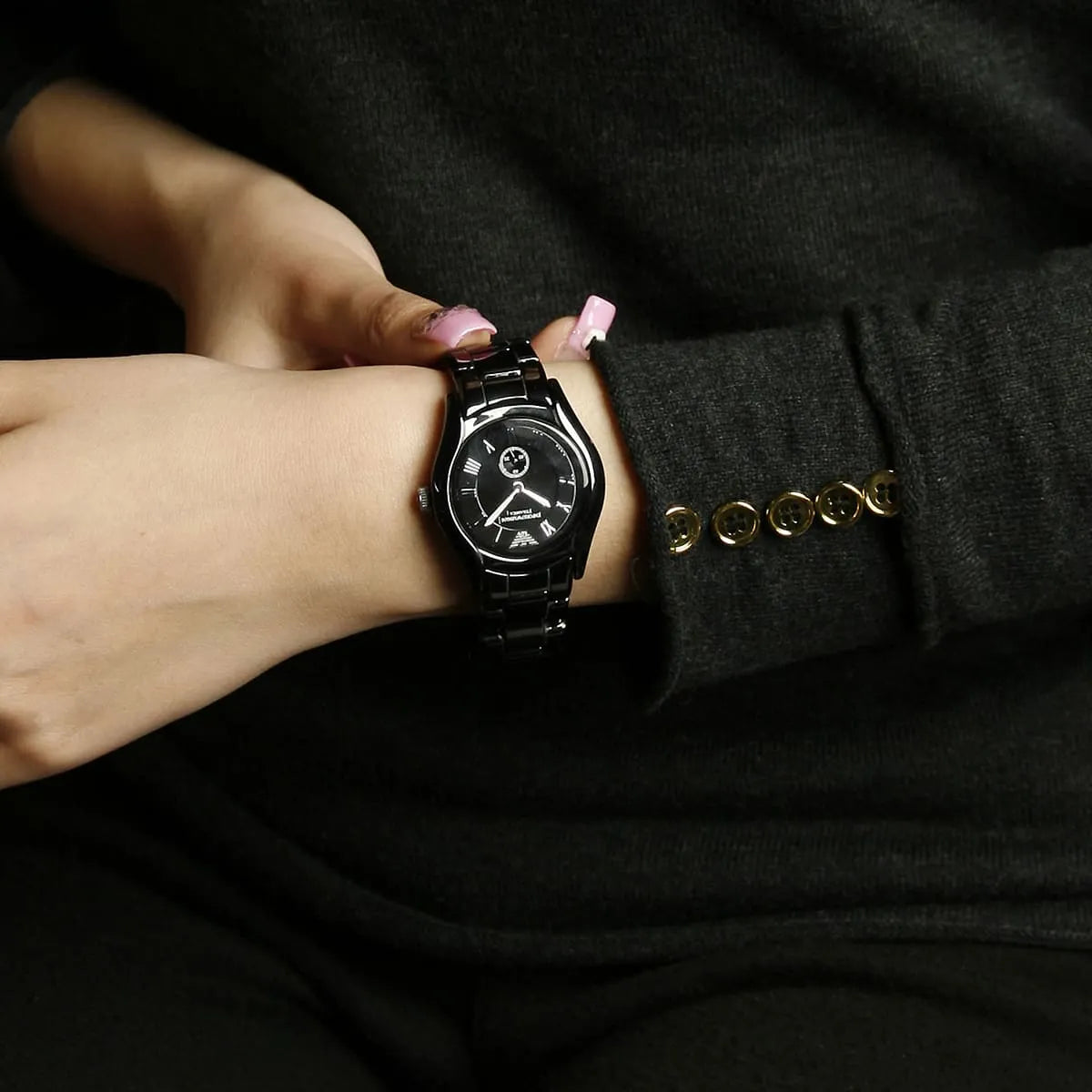 Emporio Armani Ceramica watch worn on wrist with black dial and ceramic bracelet