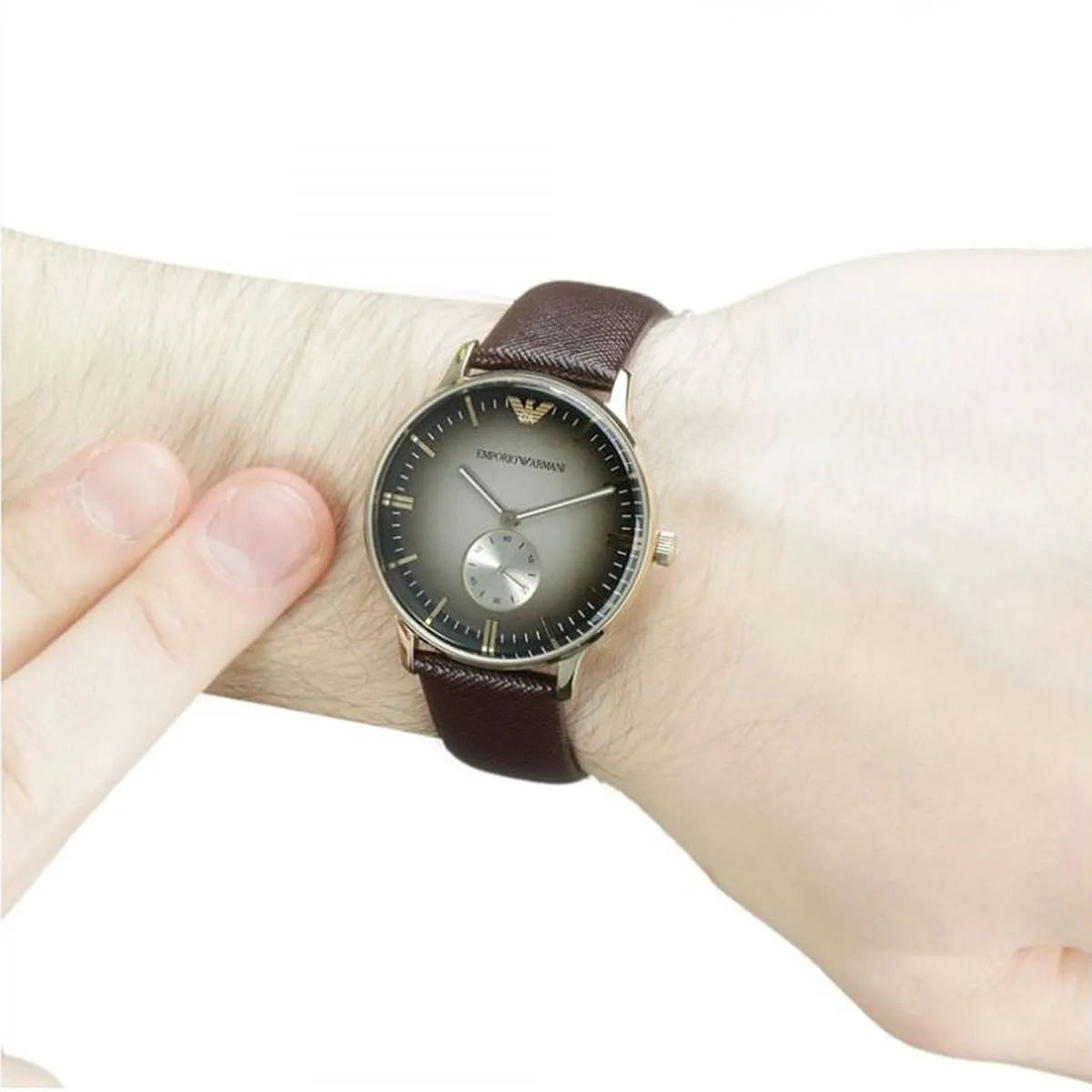 Emporio Armani Alpha Medium watch worn on wrist showing brown dial and leather strap fit