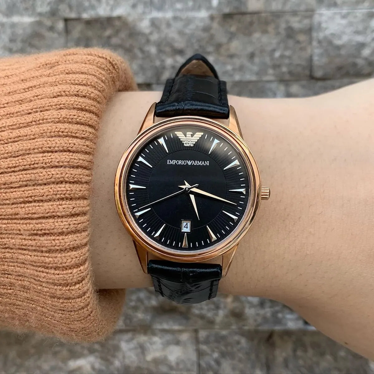 Emporio Armani AR2445 women's watch worn on wrist with black dial and rose gold case