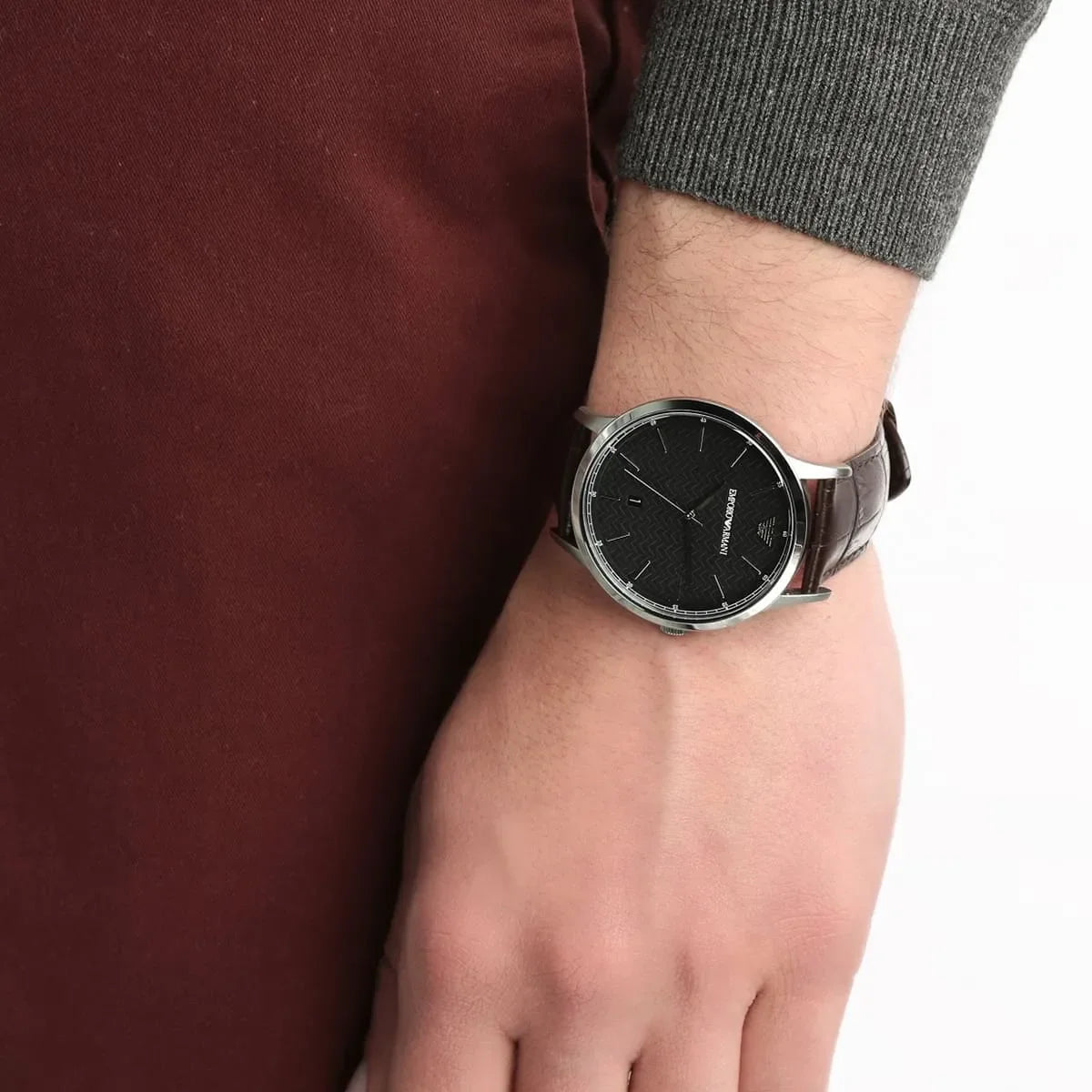 Emporio Armani AR2480 men's watch on wrist showing black dial and brown leather strap