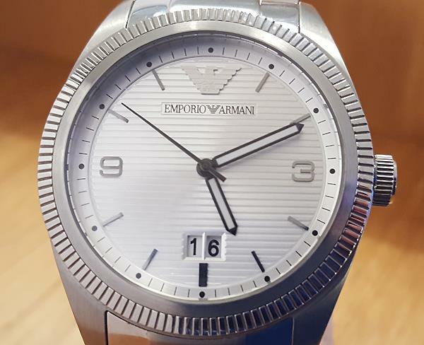 Close-up of AR5894 dial showing silver textured surface, applied indices, and date display