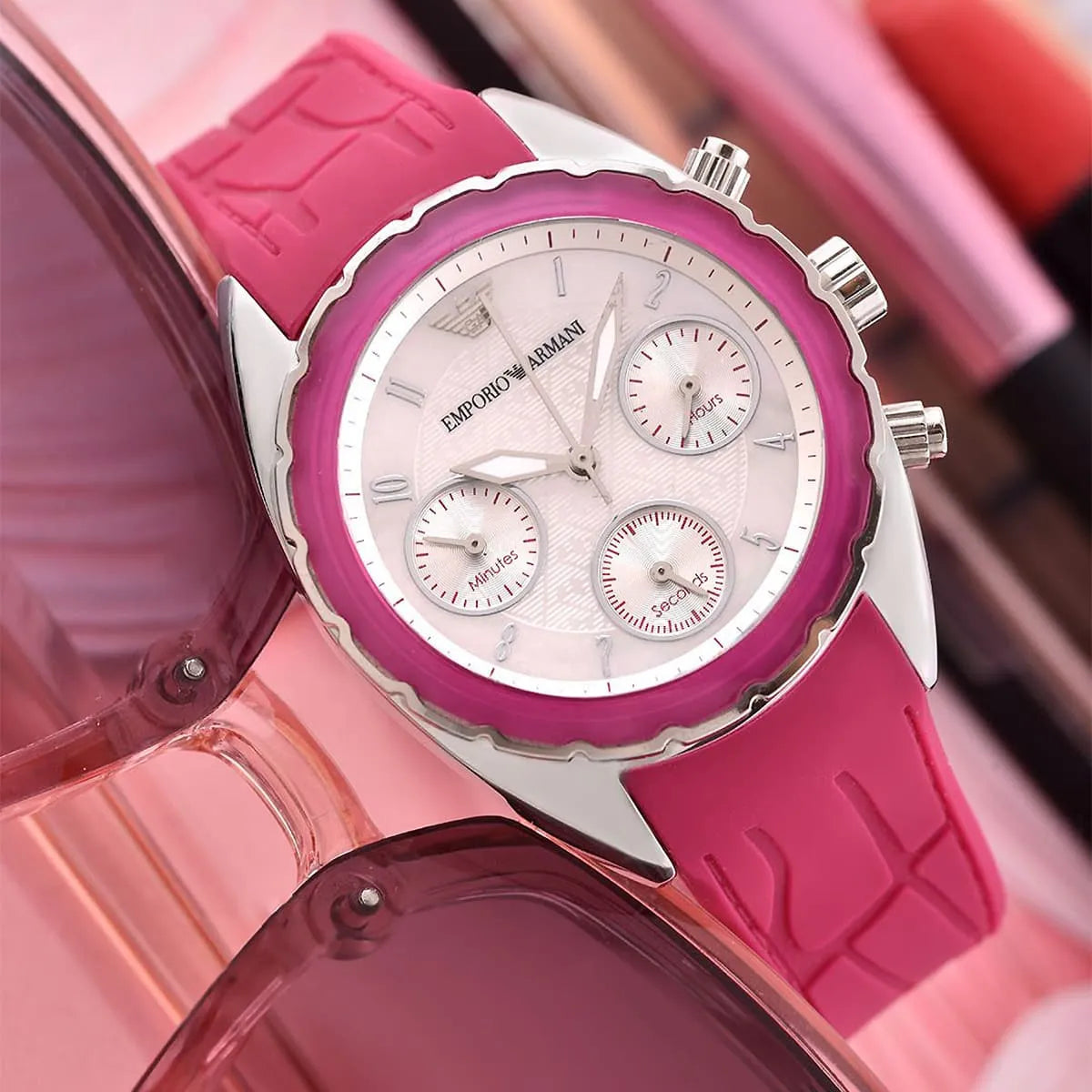 Emporio Armani Sport Chronograph hot pink watch worn on wrist with white dial and chronograph subdials visible