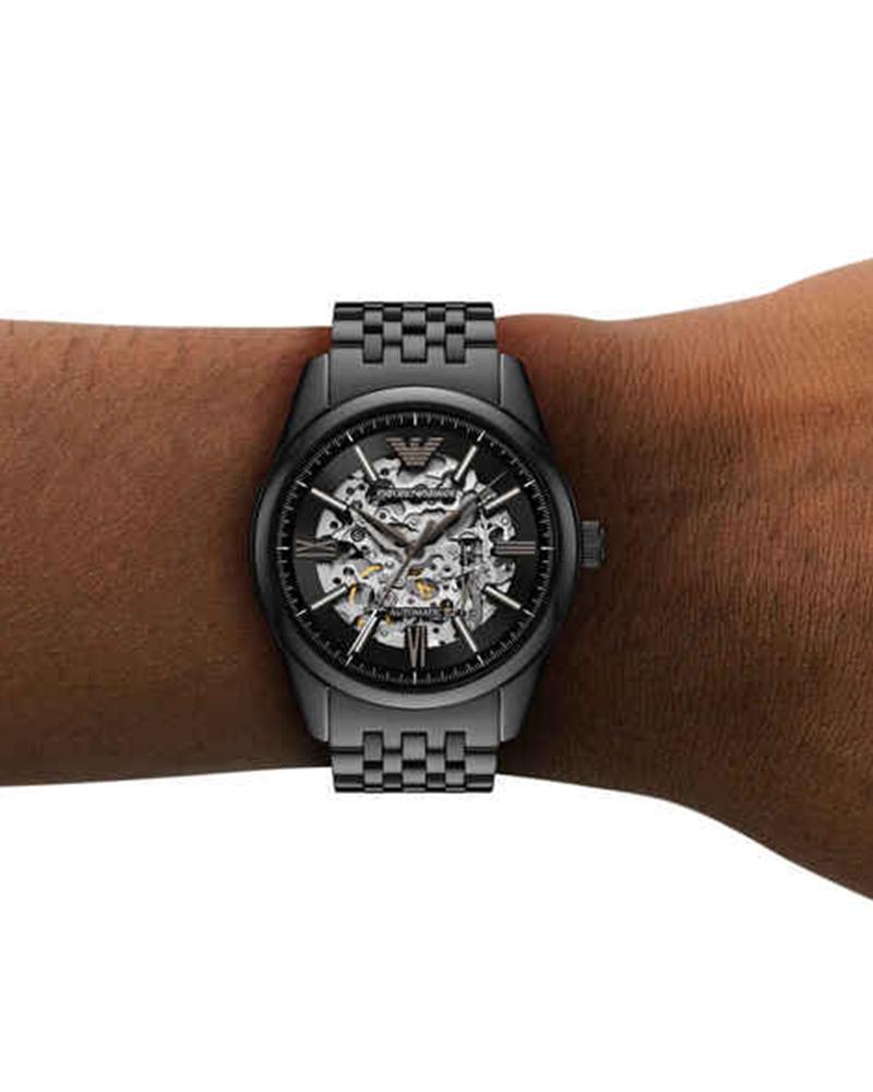 Emporio Armani Antonio skeleton dial watch on wrist with steel bracelet