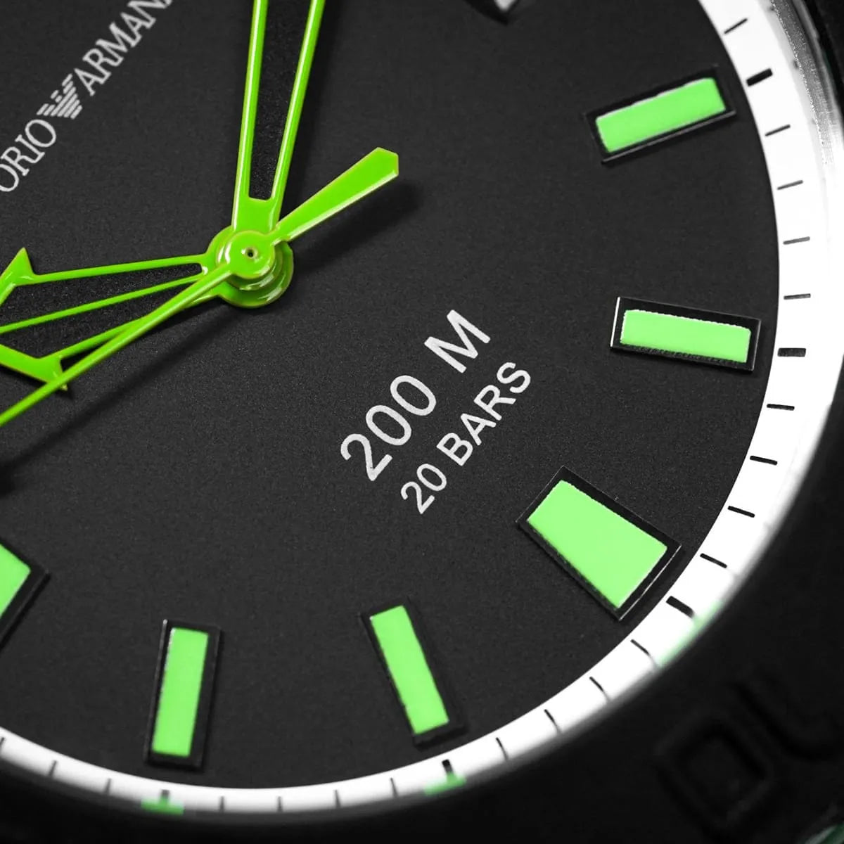 AR6102 black dial detail showing green hands, hour markers, and 200M water resistance text