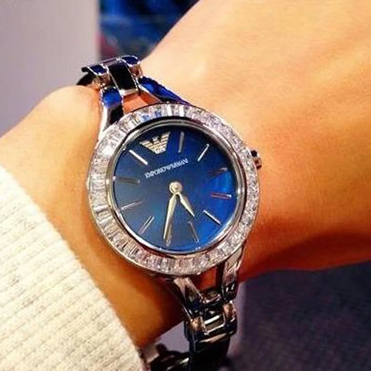 Emporio Armani Chiara watch worn on wrist with blue dial and crystal bezel