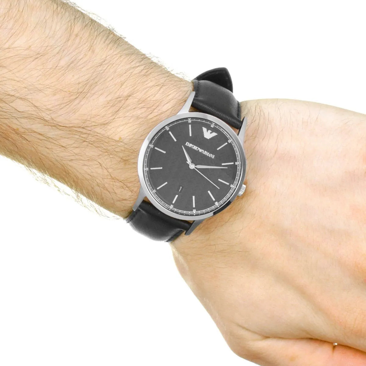 Emporio Armani Renato watch on male wrist showing black dial and black leather strap