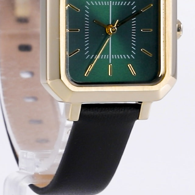 AX5723 dial detail showing three hands and hour markers on green face