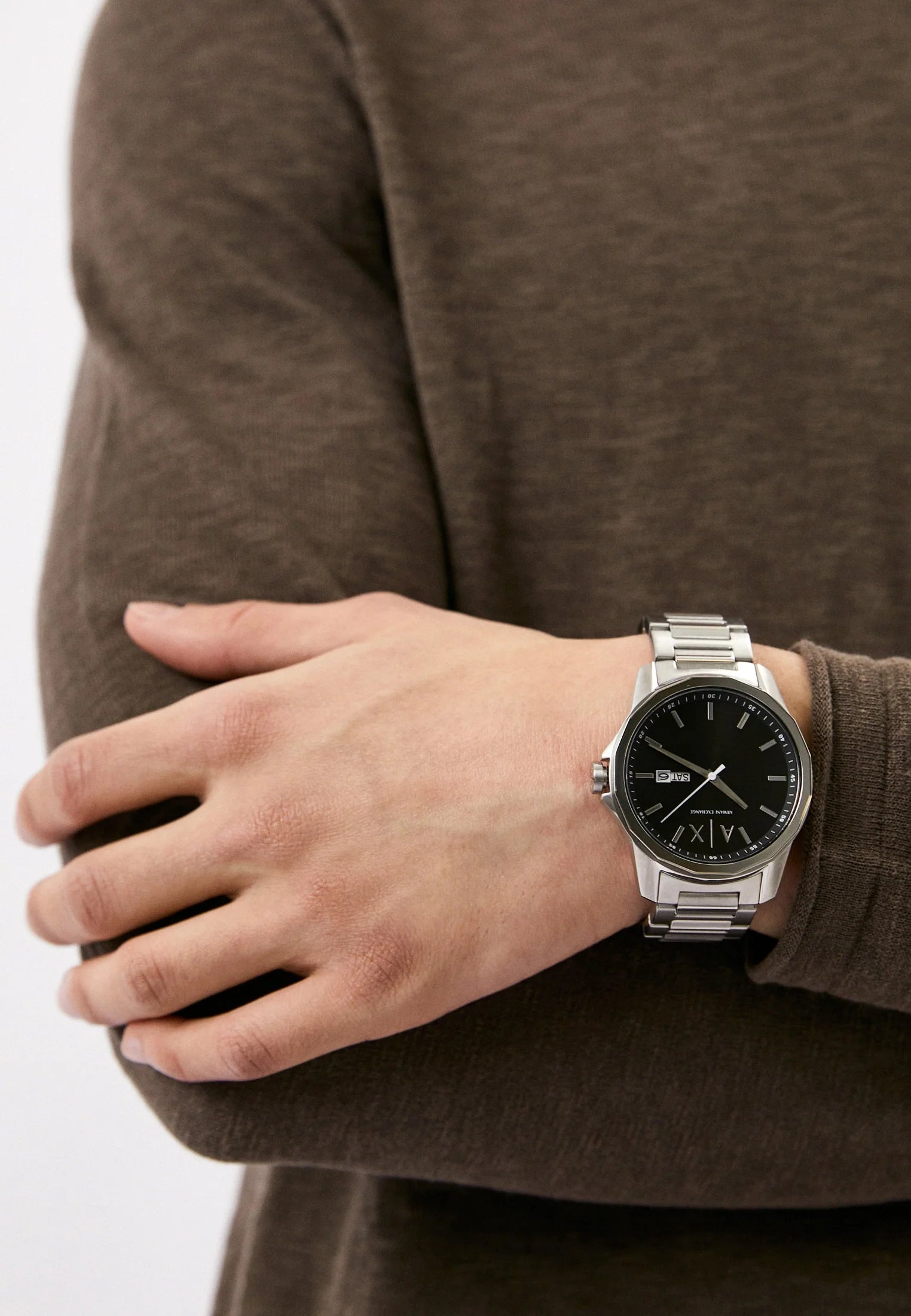 Armani Exchange Banks AX1733 watch worn on wrist showing black dial and silver bracelet