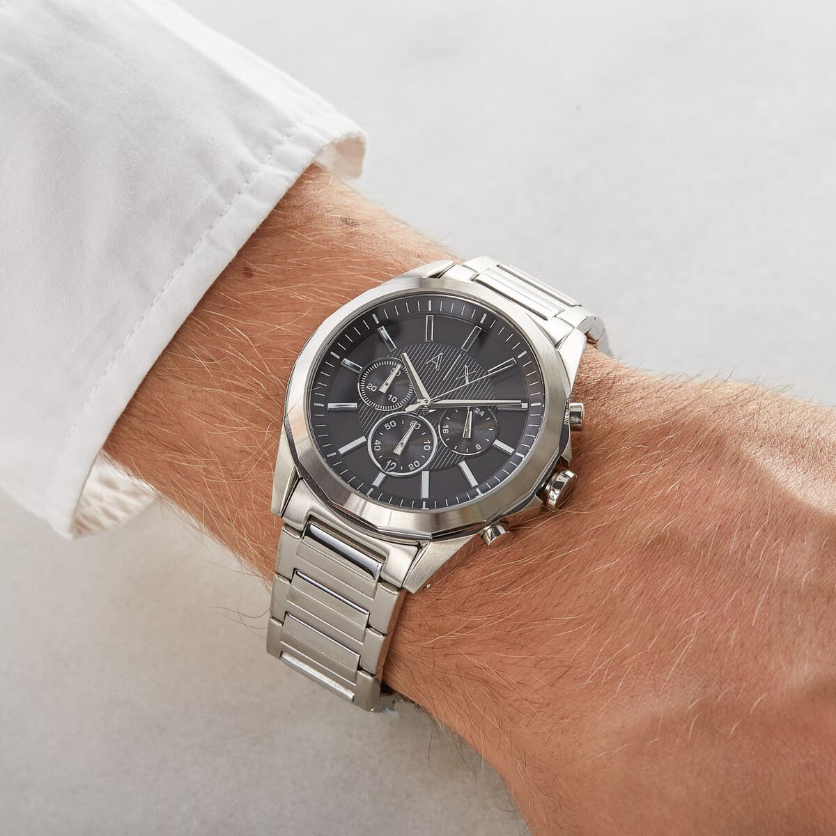 Armani Exchange Drexler AX2603 chronograph watch worn on wrist with white shirt