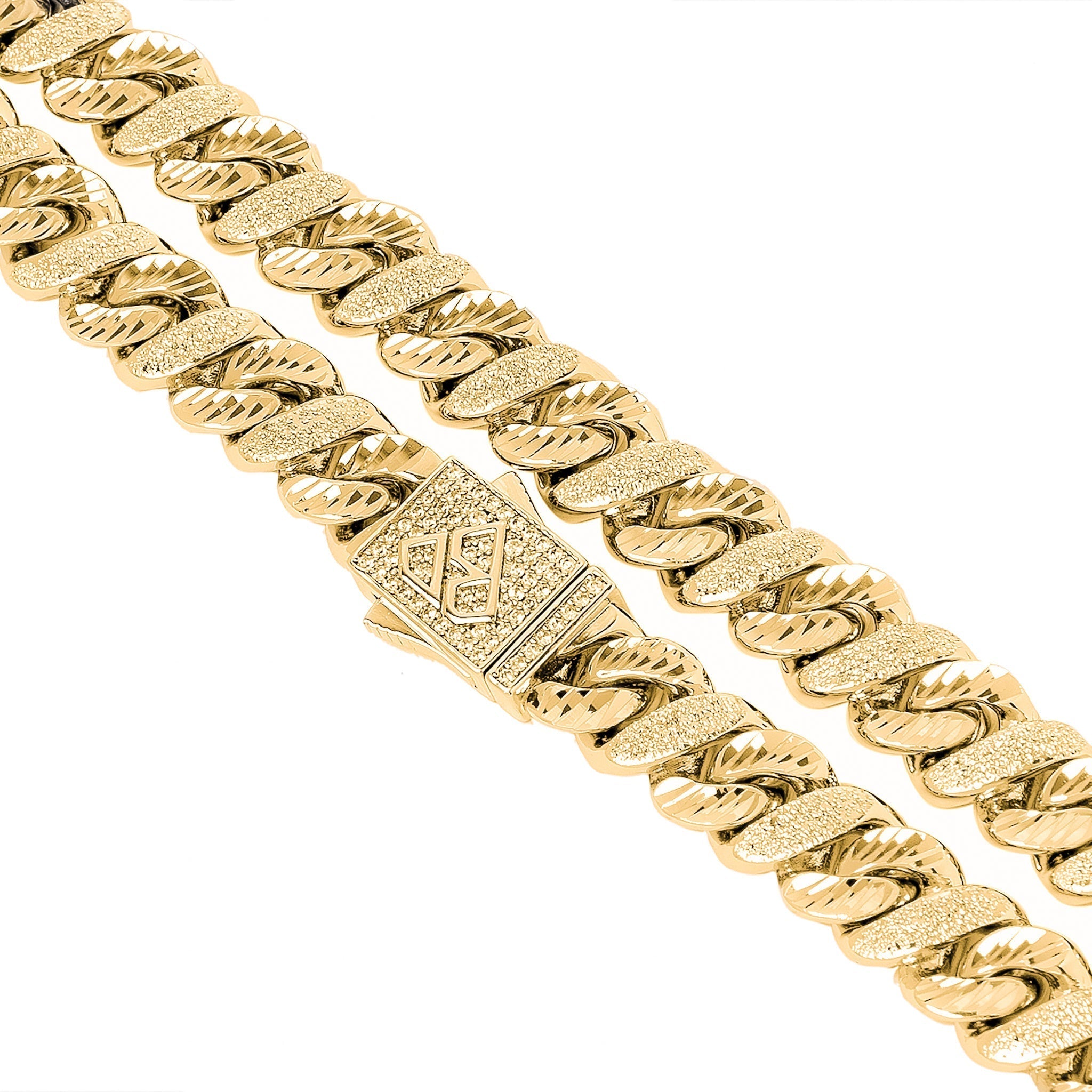 Detailed view of sandblast texture and diamond setting on gold chain links and clasp