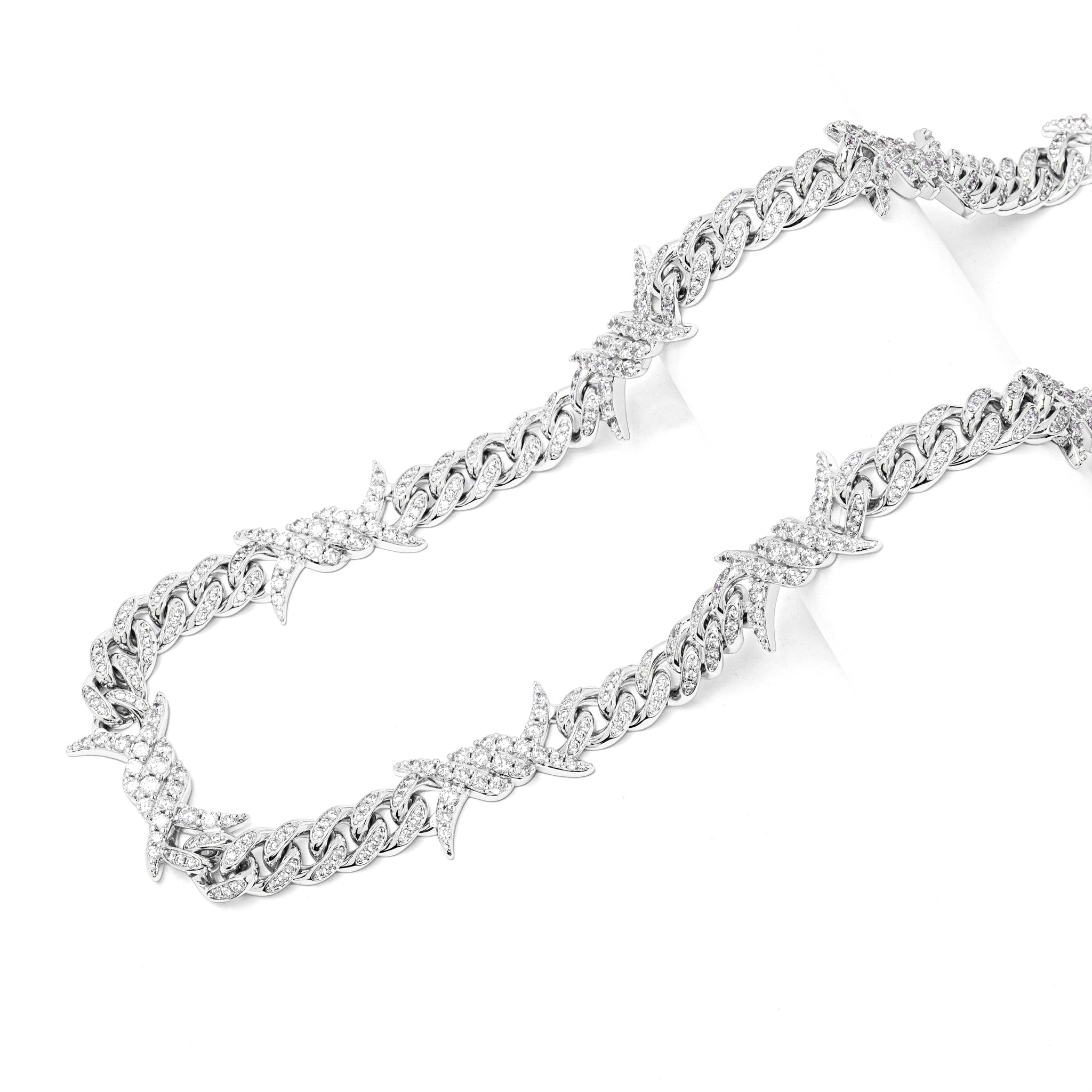 Side angle showing full length of Big Daddy 10MM iced out chain with horn spikes