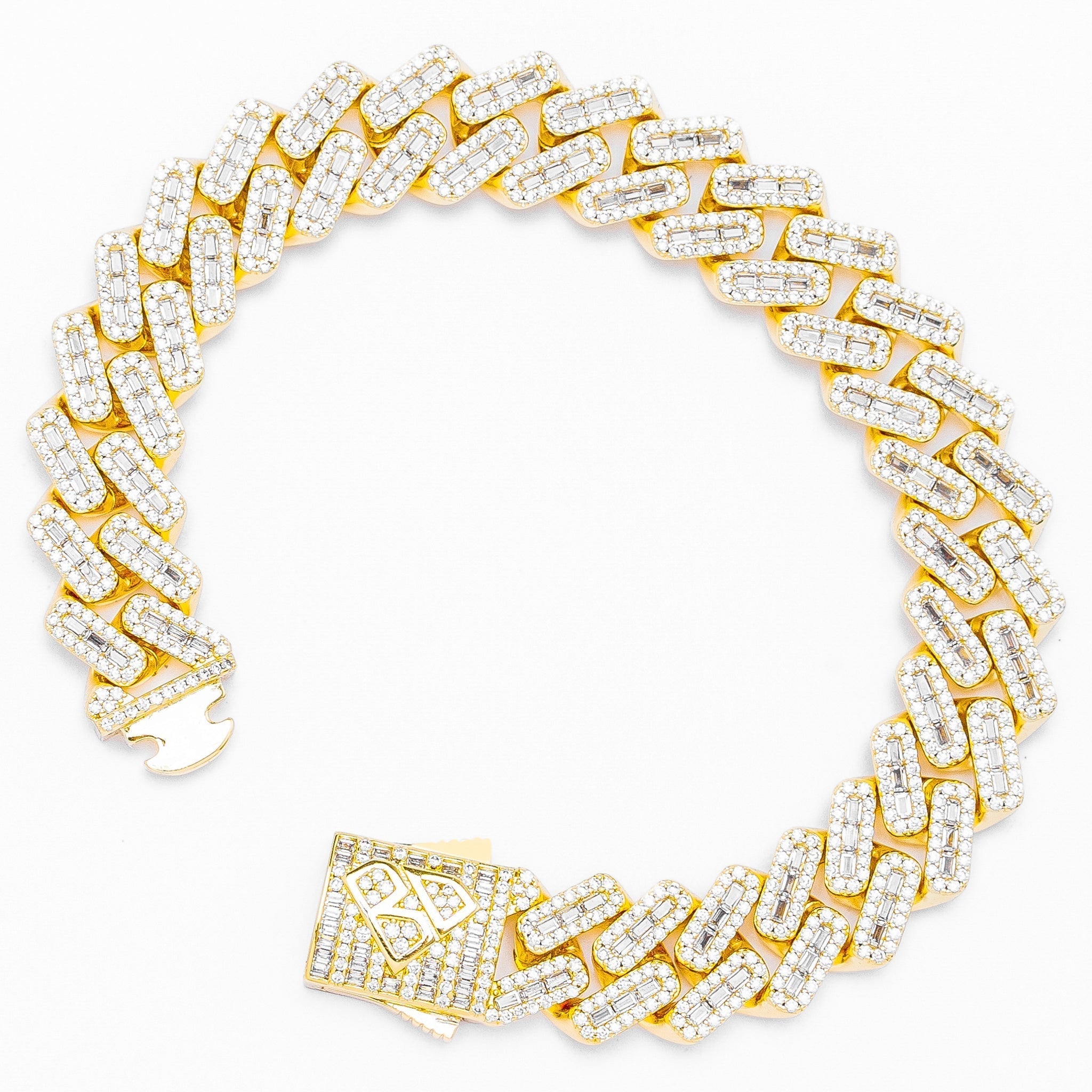 Gold Cuban chain bracelet with pave set baguette diamonds and rhombus clasp detail